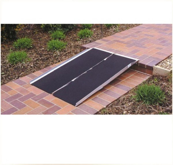 Portable ramp on sidewalk step